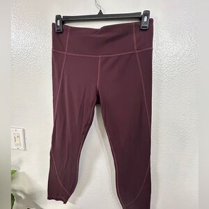 ATHLETA 7/8 leggings salutation in Powervita Cassis Size L.